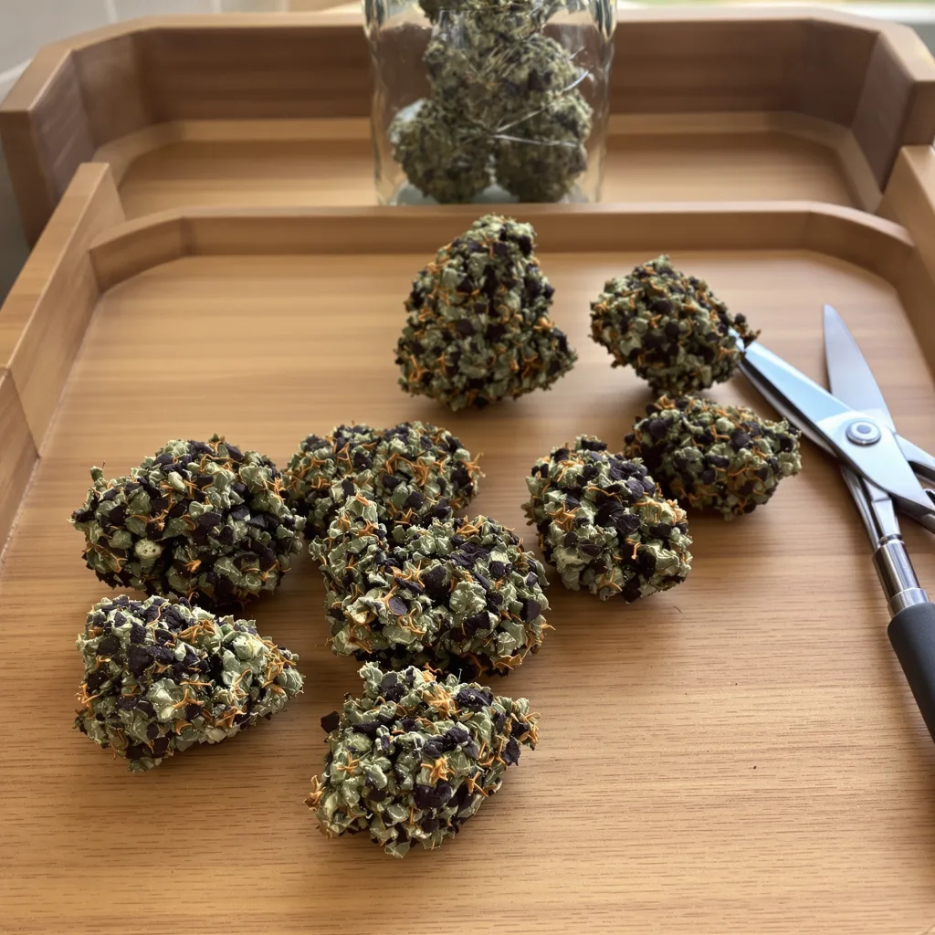 Cluster Bomb 79% indica / 21% sativa flower with visible trichomes